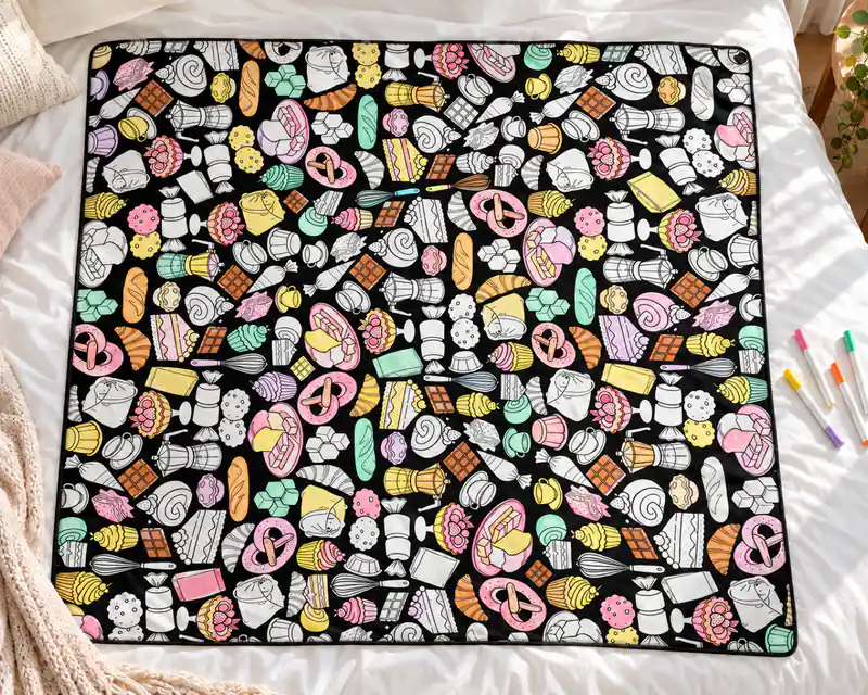 The Bakery coloring blanket, partly colored in with markers