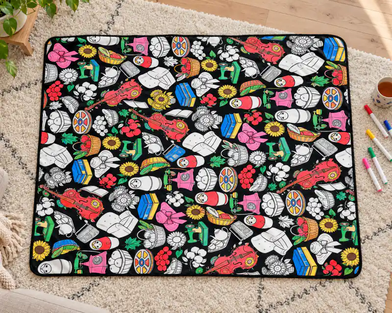 The Country Market coloring blanket, partly colored in with markers