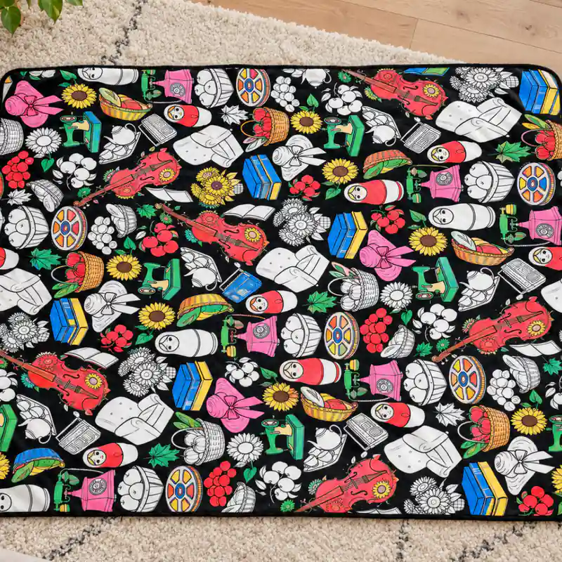 The Country Market coloring blanket, partly colored in with fabric markers