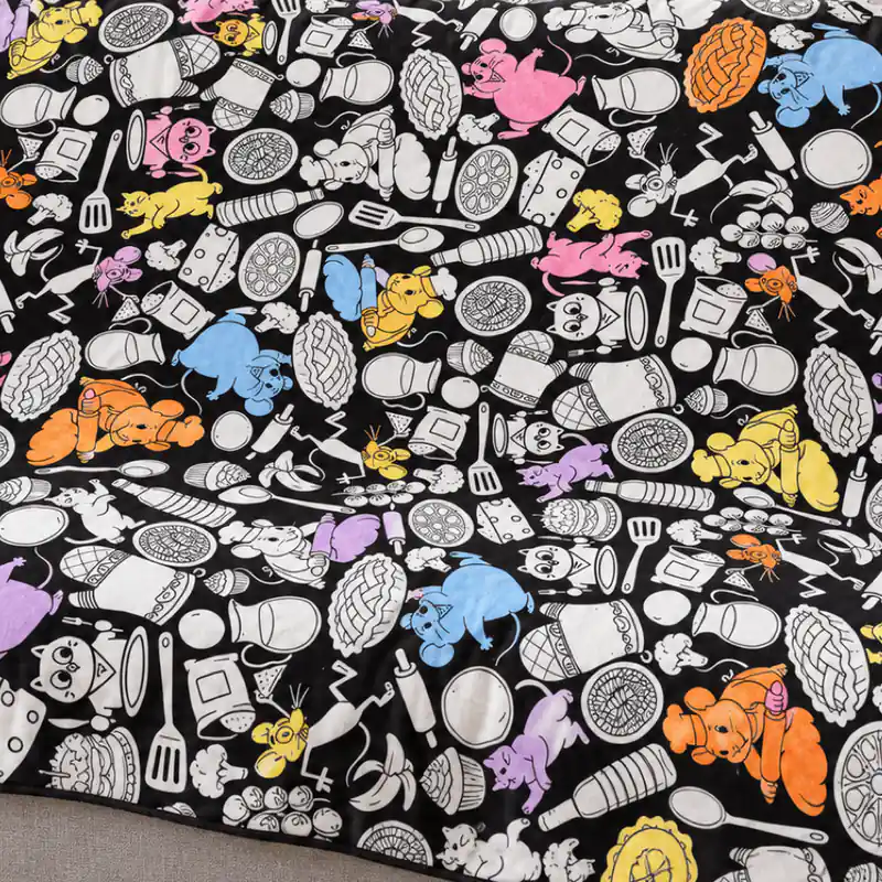 Close-up of a coloring blanket design partly colored in with fabric markers